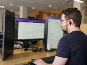 A man offering remote support via his computer
